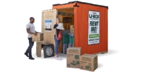 Couple loading a U-Box container.