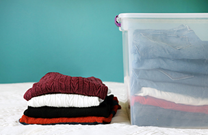 Folded cloths on bed