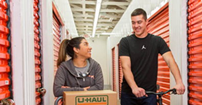 Couple loading a U-Haul storage unit