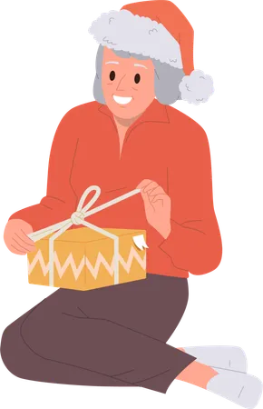 Elderly aged woman feeling happy opening wrapped gift box  Illustration