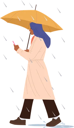 Woman with umbrella walking under rain using mobile  Illustration