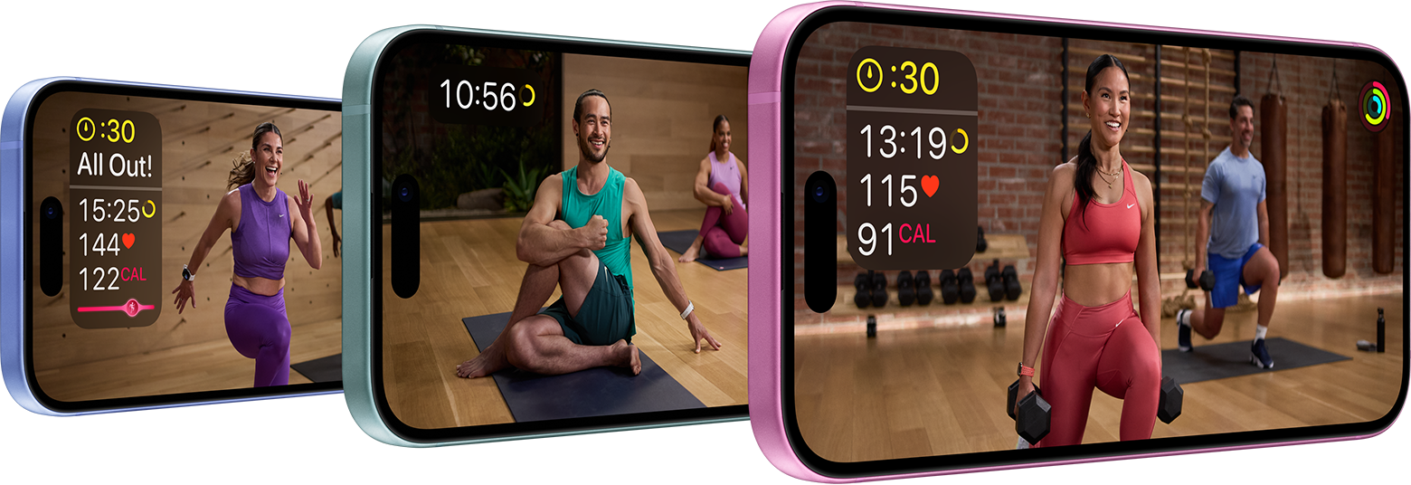 Three iPhones show different workouts. The first shows a person in purple running with metrics being displayed. The second shows a person in green stretching. The third shows a person in pink using weights with metrics being displayed.