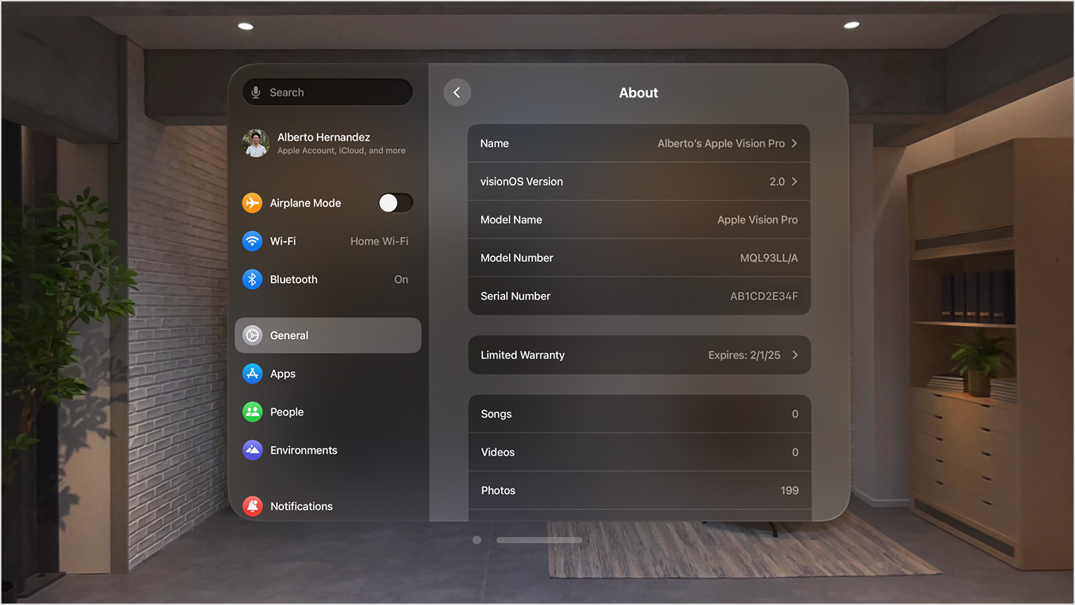 Apple Vision Pro Settings app showing the About screen in a living room