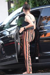 Mila Kunis Nails Casual-Chic in Striped Trousers for LA Dinner Date