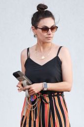 Mila Kunis Nails Casual-Chic in Striped Trousers for LA Dinner Date