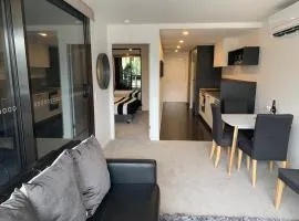 Midnight Luxe 1BR 1Bath Apartment 104 in the heart of Braddon Pool Sauna Secure Parking Wine WiFi