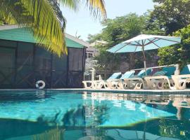 Hummingbirds Cabins, villa in Caye Caulker