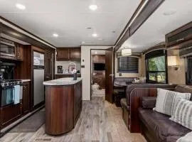 RV located on private property, providing access to the Guadalupe River, accommodates up to 7 guests