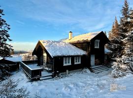 Cozy log cabin in Hafjell ski in out and sauna, хотел в Хафиел