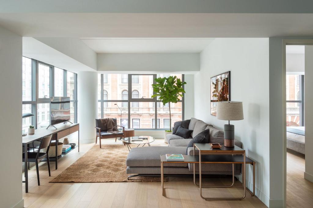 a living room with a couch and a table at ROOST East Market in Philadelphia