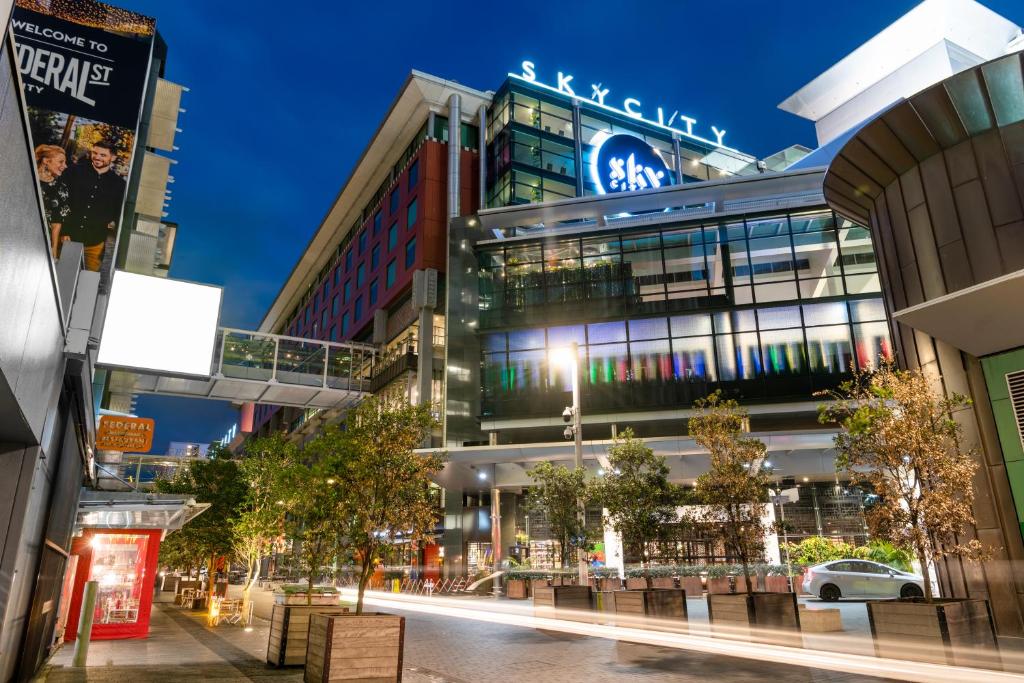 a building with a sign on it on a city street at SkyCity Hotel Auckland in Auckland