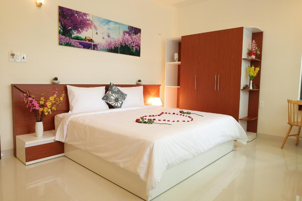 Tempat tidur dalam kamar di Lam Garden Boutique Homestay