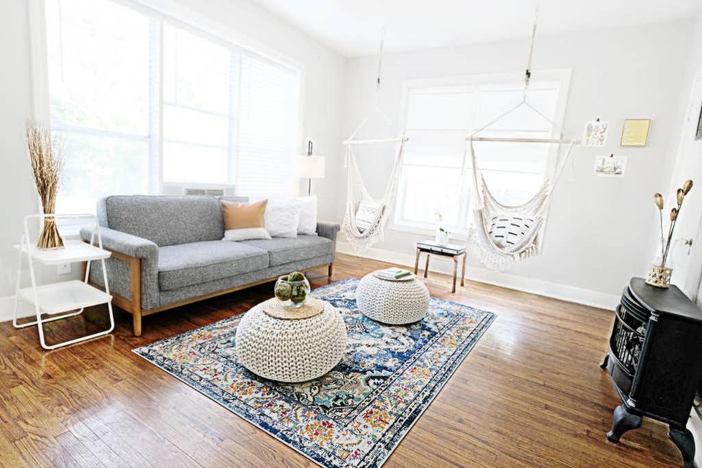 a living room with a couch and a table at Dallas Native, Lower-Greenville Ave Area in Dallas