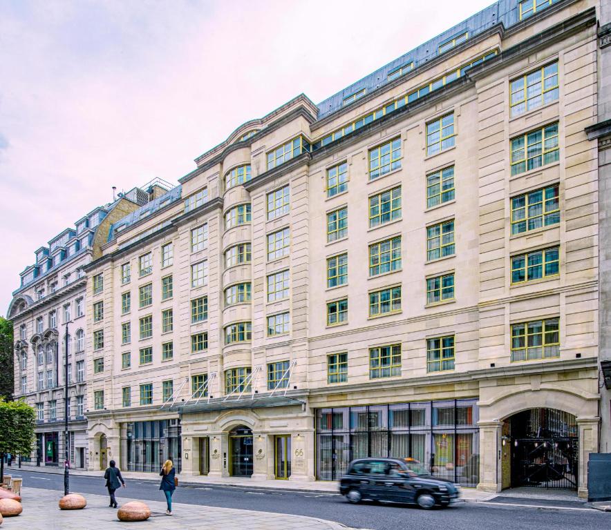 a large building with a car parked in front of it at Middle Eight - Covent Garden - Preferred Hotels and Resorts in London