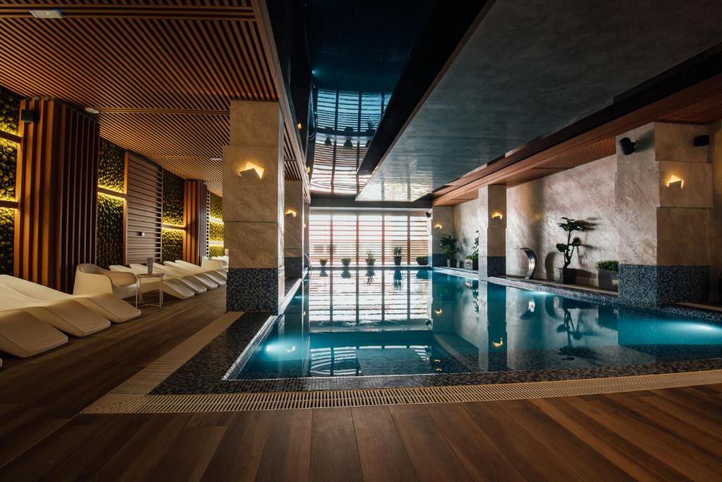 a pool in the middle of a room at Fabesca Boutique Hotel & SPA in Sovata