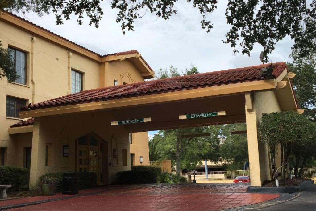 a building with a sign in front of it at Days Inn by Wyndham Gainesville Florida in Gainesville