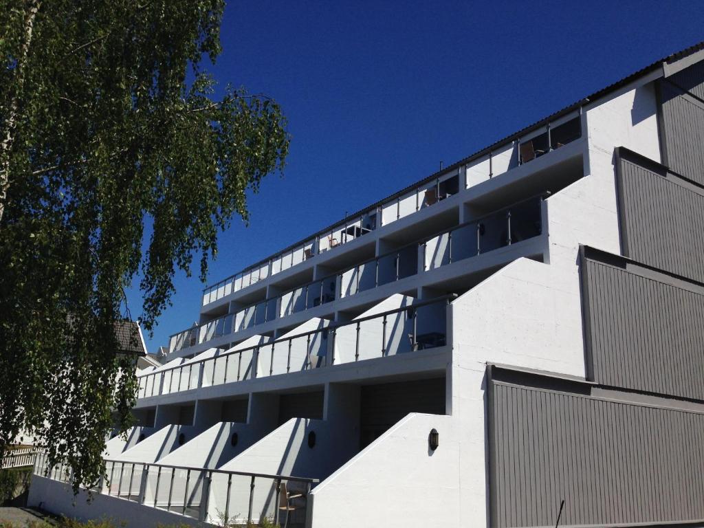 a white building with a lot of windows at Hamresanden Resort in Kristiansand