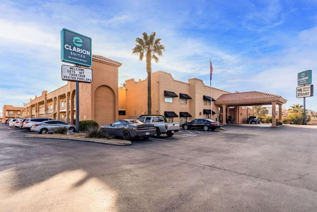 a parking lot with cars parked in front of a hotel at Clarion Suites St George - Convention Center Area in St. George