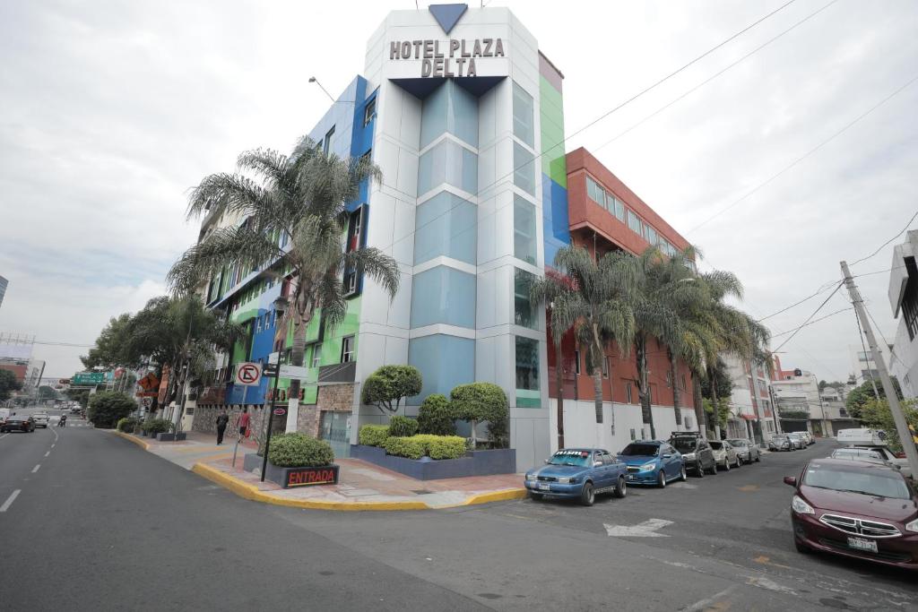 a hotel building with a sign on top of it at Hotel Plaza Delta in Mexico City