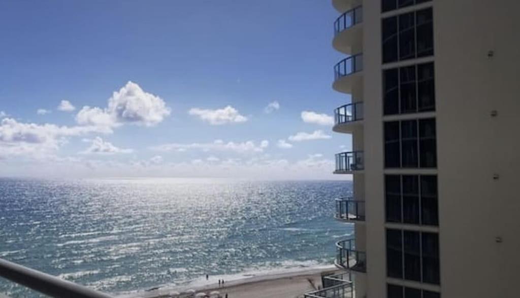 a view of the ocean from the balcony of a building at Best Resort Beach Front Condo in Miami Beach