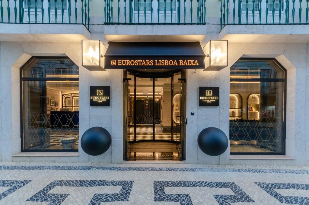 a store front with a sign on the front of a building at Eurostars Lisboa Baixa in Lisbon