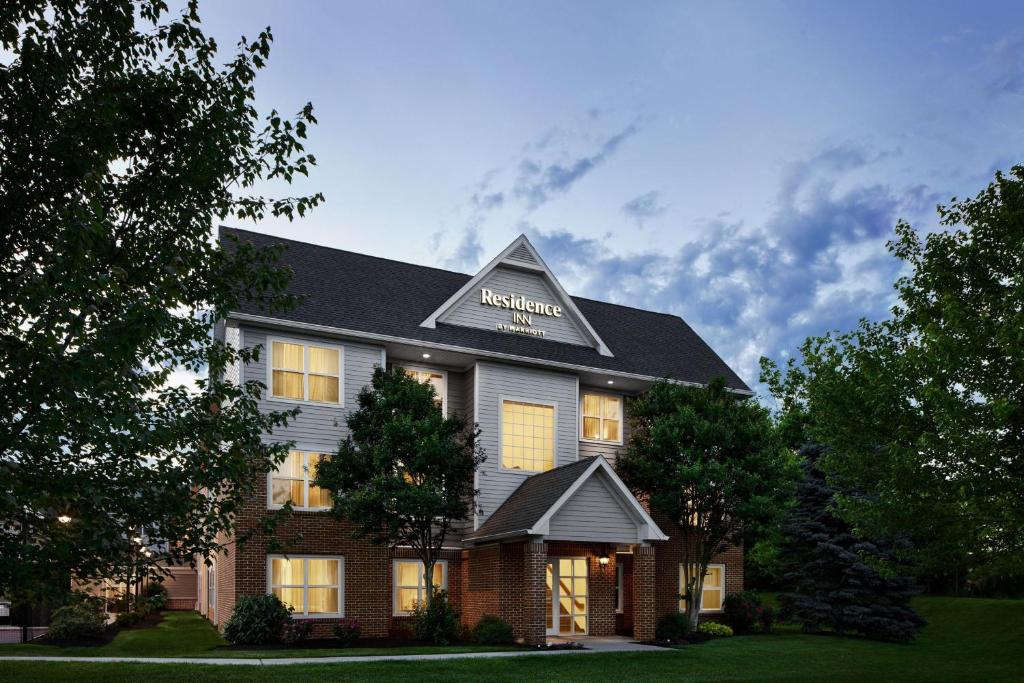 a hotel with a sign on the front of it at Residence Inn by Marriott Harrisburg Carlisle in Carlisle