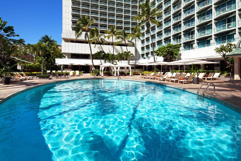 a large swimming pool in front of a hotel at Sheraton Princess Kaiulani in Honolulu