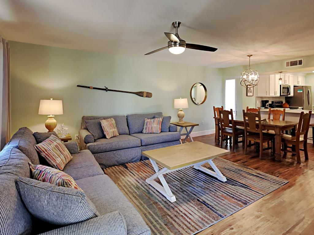 a living room with a couch and a table at Edgewater Villa 2406 in Panama City Beach