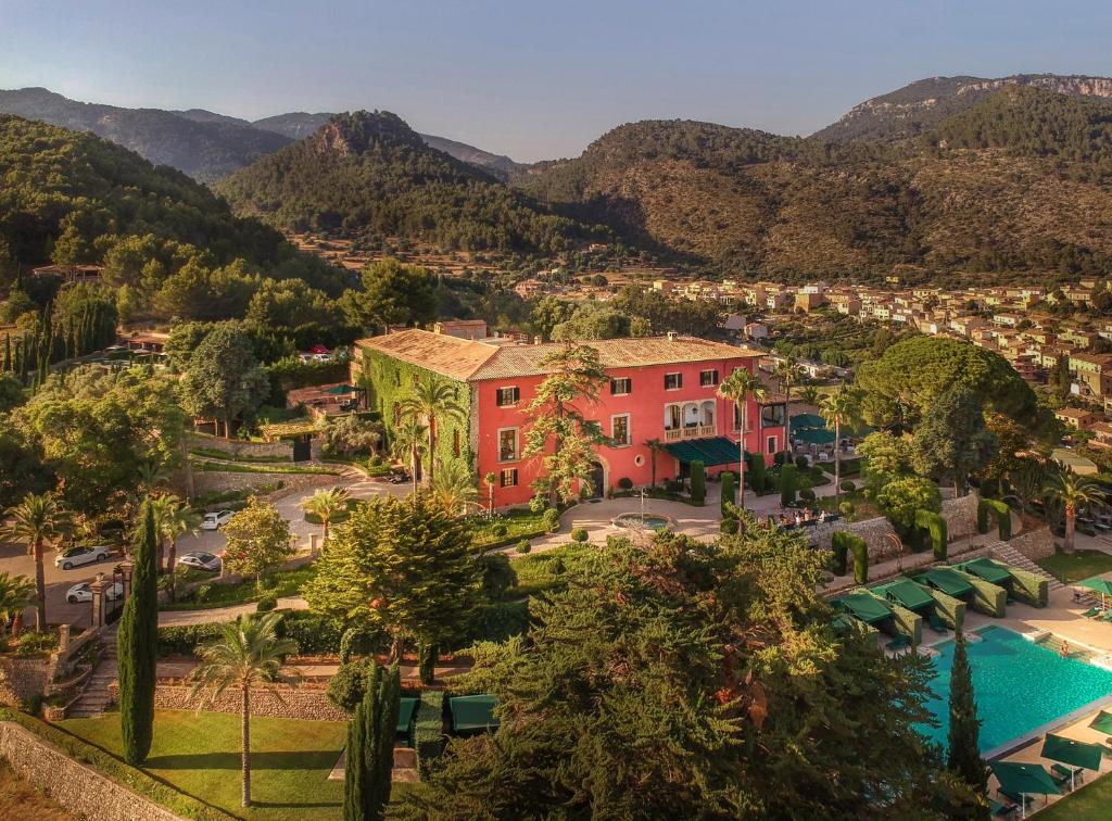 an aerial view of a resort with a pool and mountains at Grand Hotel Son Net in Puigpunyent