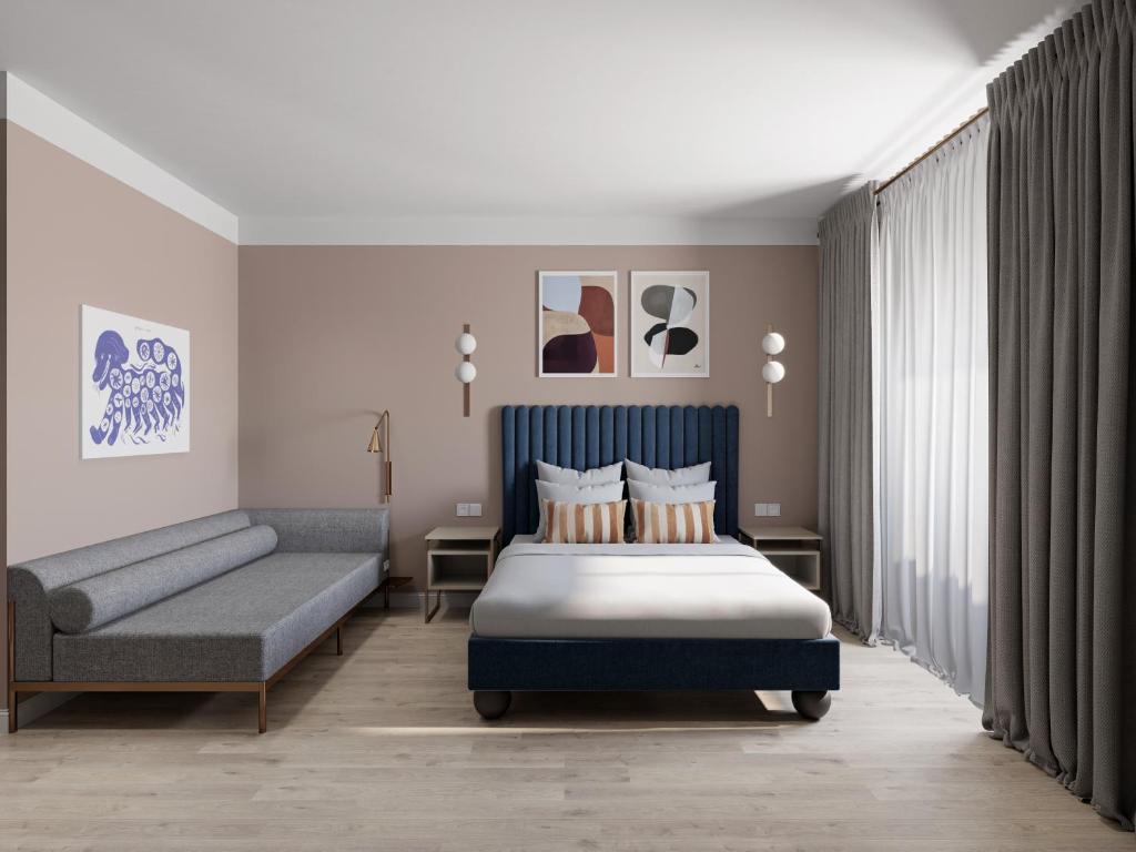 a hotel room with a bed and a couch at Numa I Linea in Rome