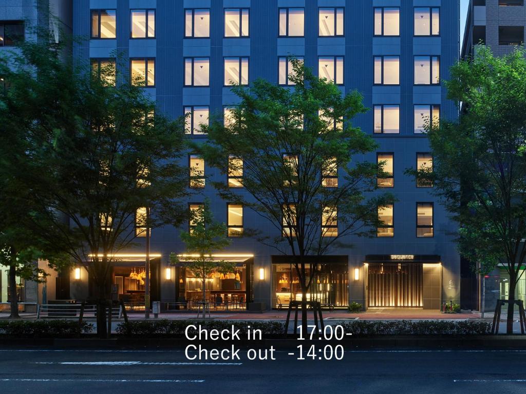 a building with lights in front of it at sequence KYOTO GOJO in Kyoto