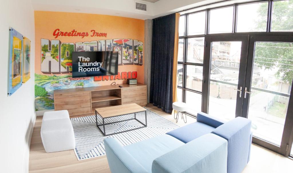 a living room with a couch and a table at The Laundry Rooms Augusta in Hamilton