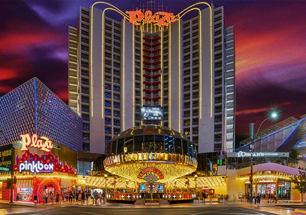 a large building with a casino in front of it at night at Plaza Hotel & Casino in Las Vegas