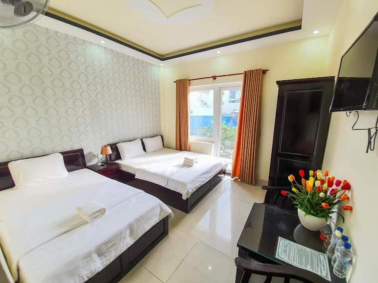 Giường trong phòng chung tại An Phat Hotel