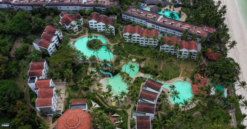 an aerial view of a resort with swimming pools at Sarova Whitesands Beach Resort & Spa in Mombasa