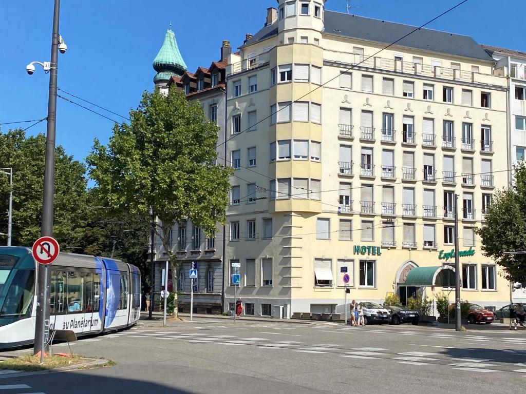 a bus on a street in front of a building at Hotel Esplanade in Strasbourg