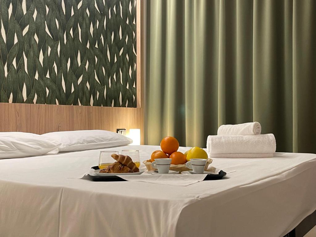 a white table with a tray of fruit on it at Aquasole in Mercallo