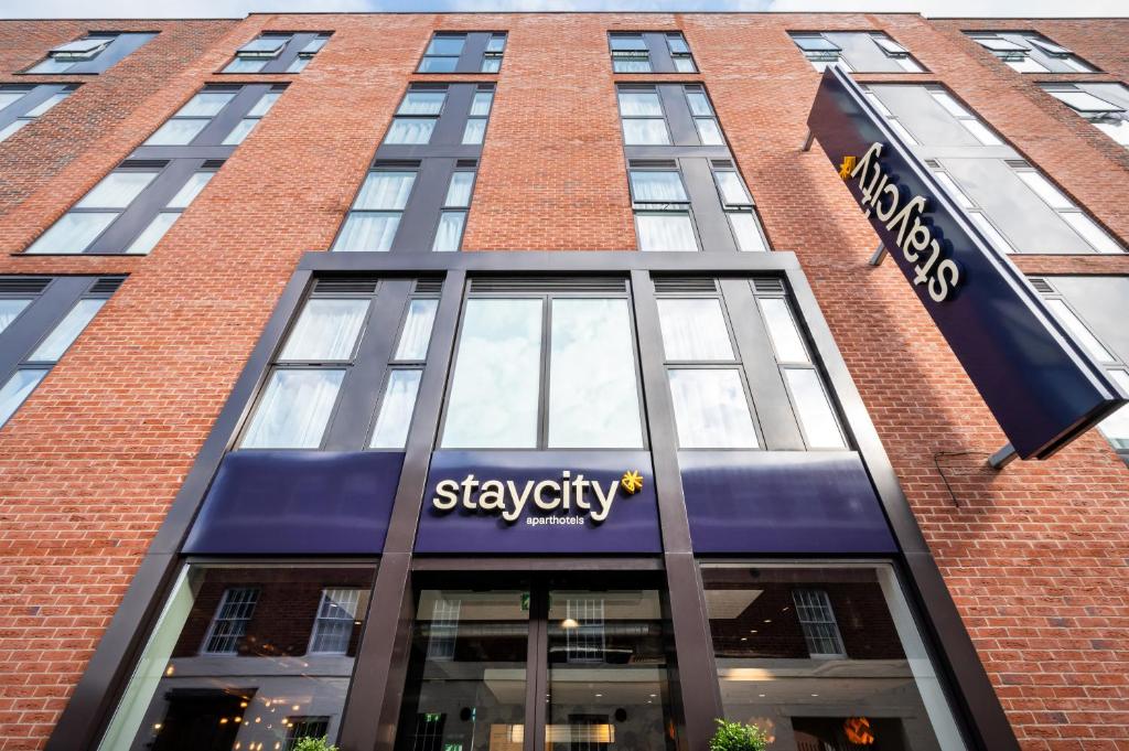 a building with a sign on the side of it at Staycity Aparthotels Birmingham Jewellery Quarter in Birmingham