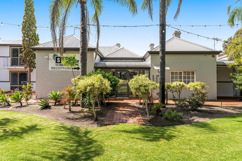 A garden outside The Swan Valley Hotel