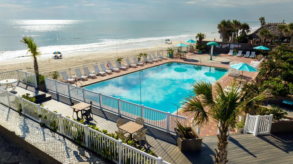 a view of a swimming pool and the beach at Boardwalk Inn and Suites in Daytona Beach