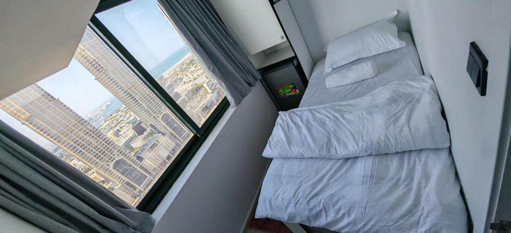 Llit o llits en una habitació de Comfort Rooms Dubai