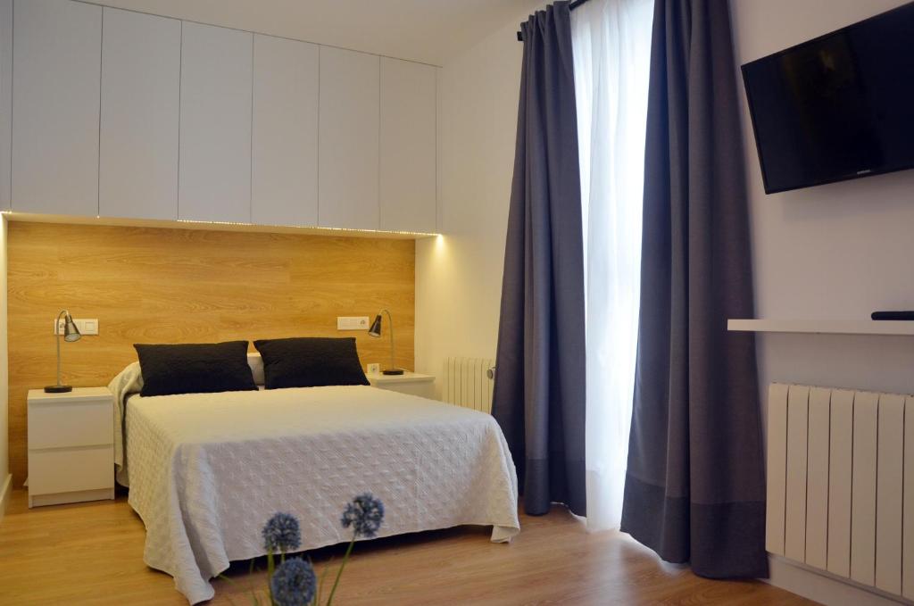 Vuode tai vuoteita majoituspaikassa Apartamentos Córdoba Atrium