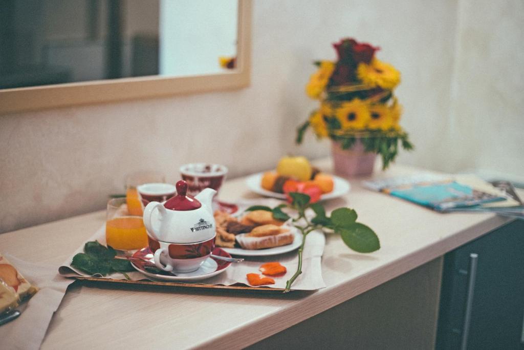 a table with a breakfast plate of food on it at Albergo della Posta in Taverna