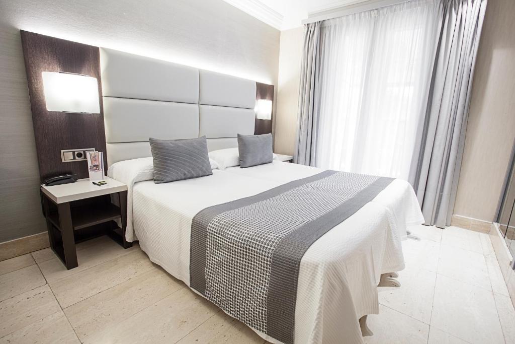 Katil atau katil-katil dalam bilik di Habitus Hotel Europa