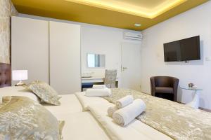 Krevet ili kreveti u jedinici u objektu Luxury Rooms Floramye