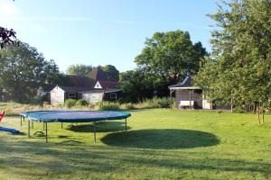 a blue trampoline in the middle of a field at Bed and Stay Amsterdam in Amsterdam