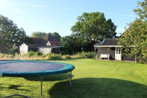 a trampoline in the yard of a house at Bed and Stay Amsterdam in Amsterdam