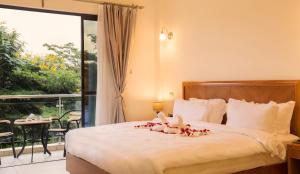 Ліжко або ліжка в номері Lotos Inn & Suites, Nairobi