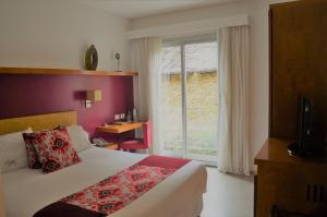 a hotel room with a bed and a window at Mine Hotel in Buenos Aires