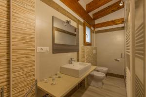 a bathroom with a sink and a toilet at Il Semaforo Sila Hotel in Taverna